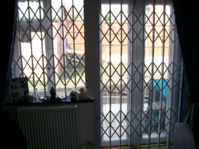 Security grilles on flag shaped door and window