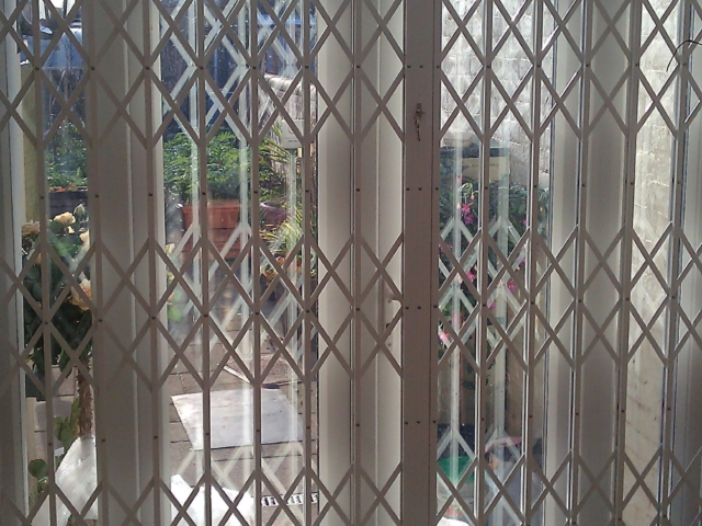 Concertina security grilles for patio door