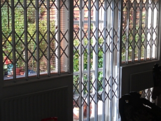 Sliding security bars for T-shaped window door