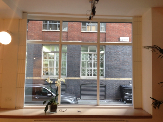 Security window grilles retracted in office