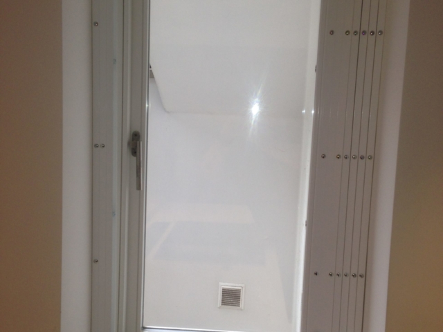 Window security grilles retracted in bathroom