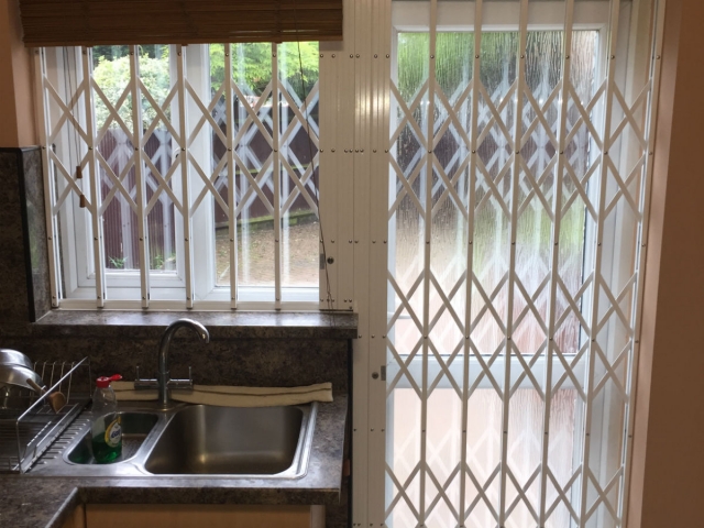 Sliding Security shutters for flag shaped kitchen window door