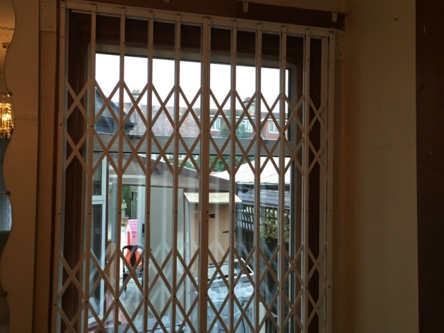 Sliding security grilles for front window