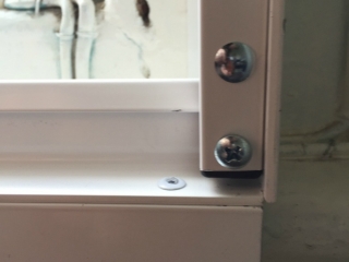 Close up fitting of face fix window security grilles Close up fitting of face fix window security grilles