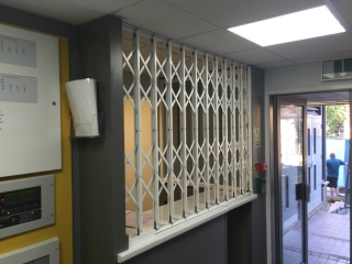 Lift out track security grille for reception desk Lift out track security grille for reception desk