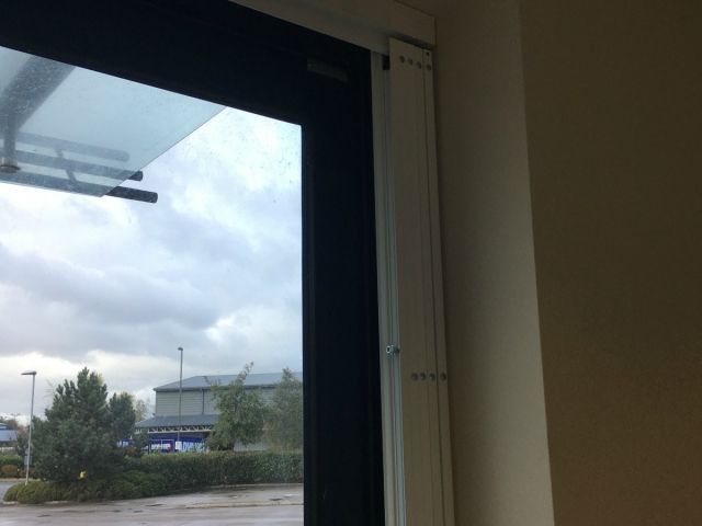 Sliding security shutter for commercial property using Lift out track