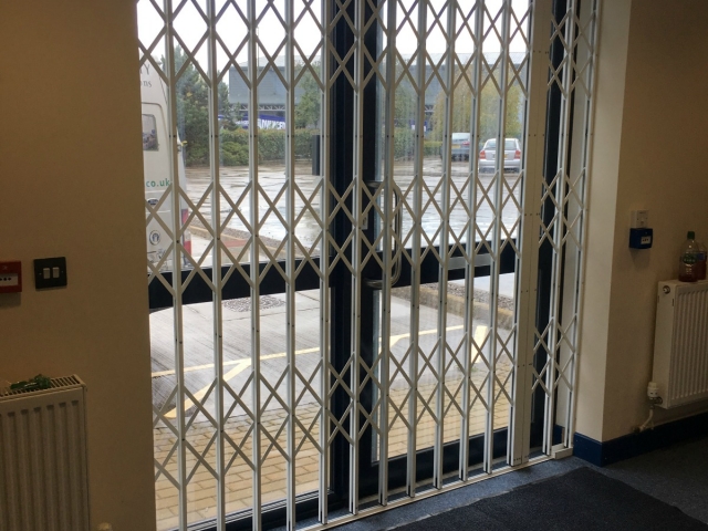 Commercial security grilles using Lift out track