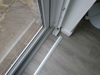 Removable track for sliding security grilles Removable track for sliding security grilles