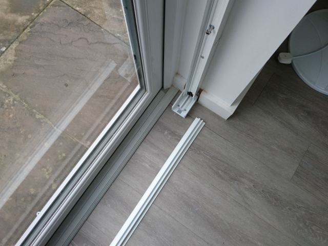 Removable track for sliding security grilles